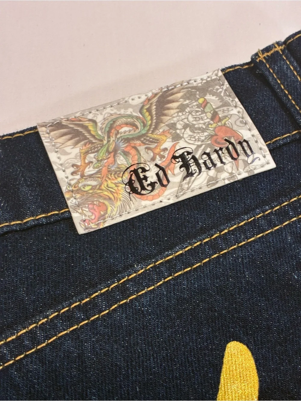 Ed Hardy Dark Blue Jeans with Yellow Script and Neon Skull Artwork